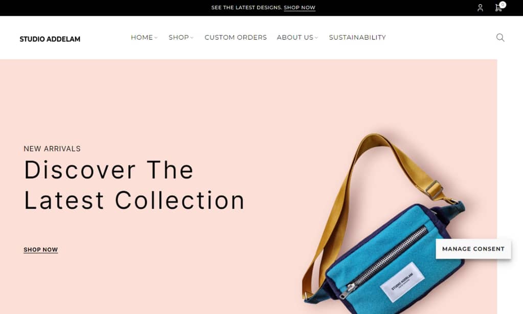 Screenshot of the Studio Addelam website which shows the logo and menu on top of a slider with a pink backgroud and a crossbody bag.